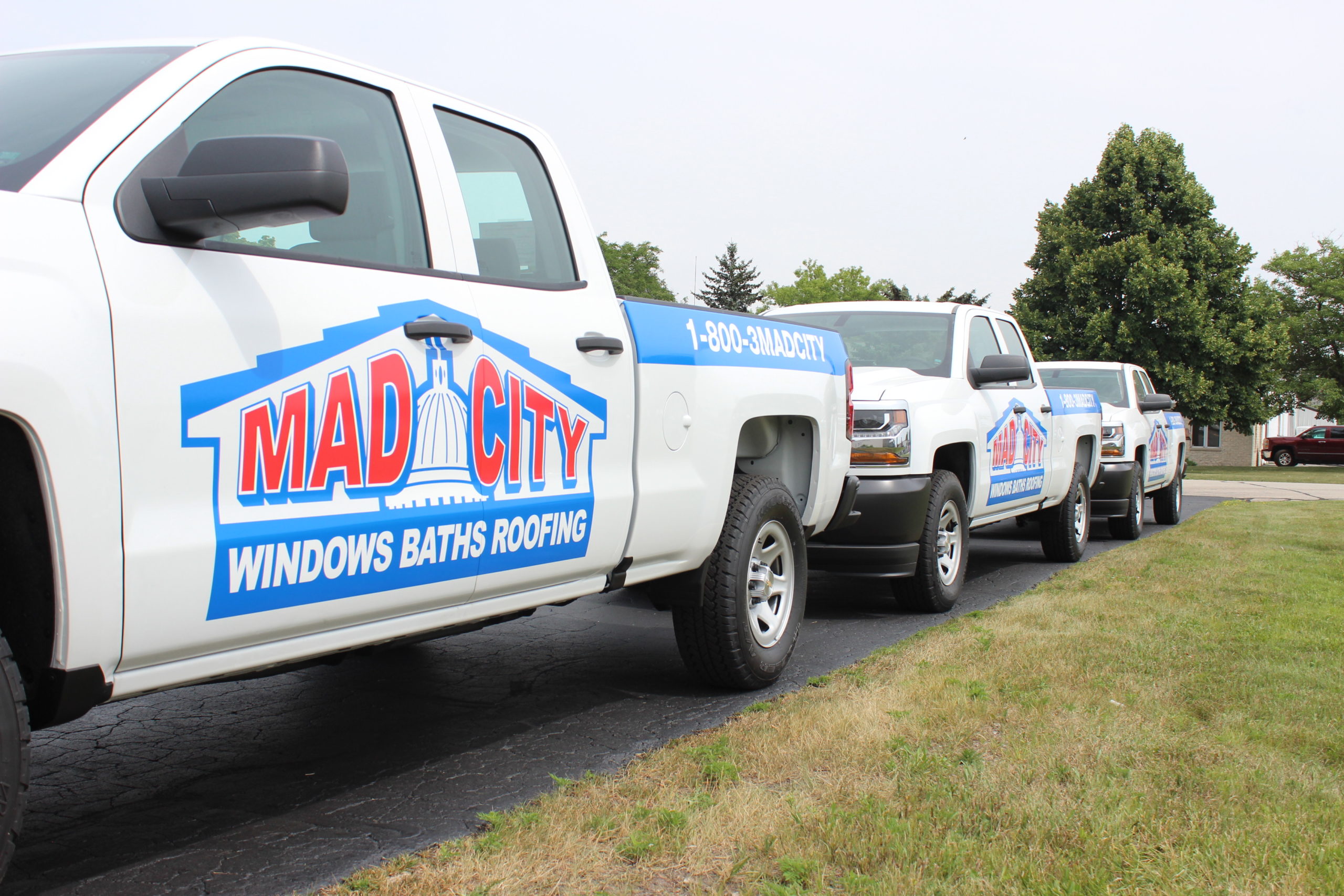 mad city windows bath and roofing truck wraps