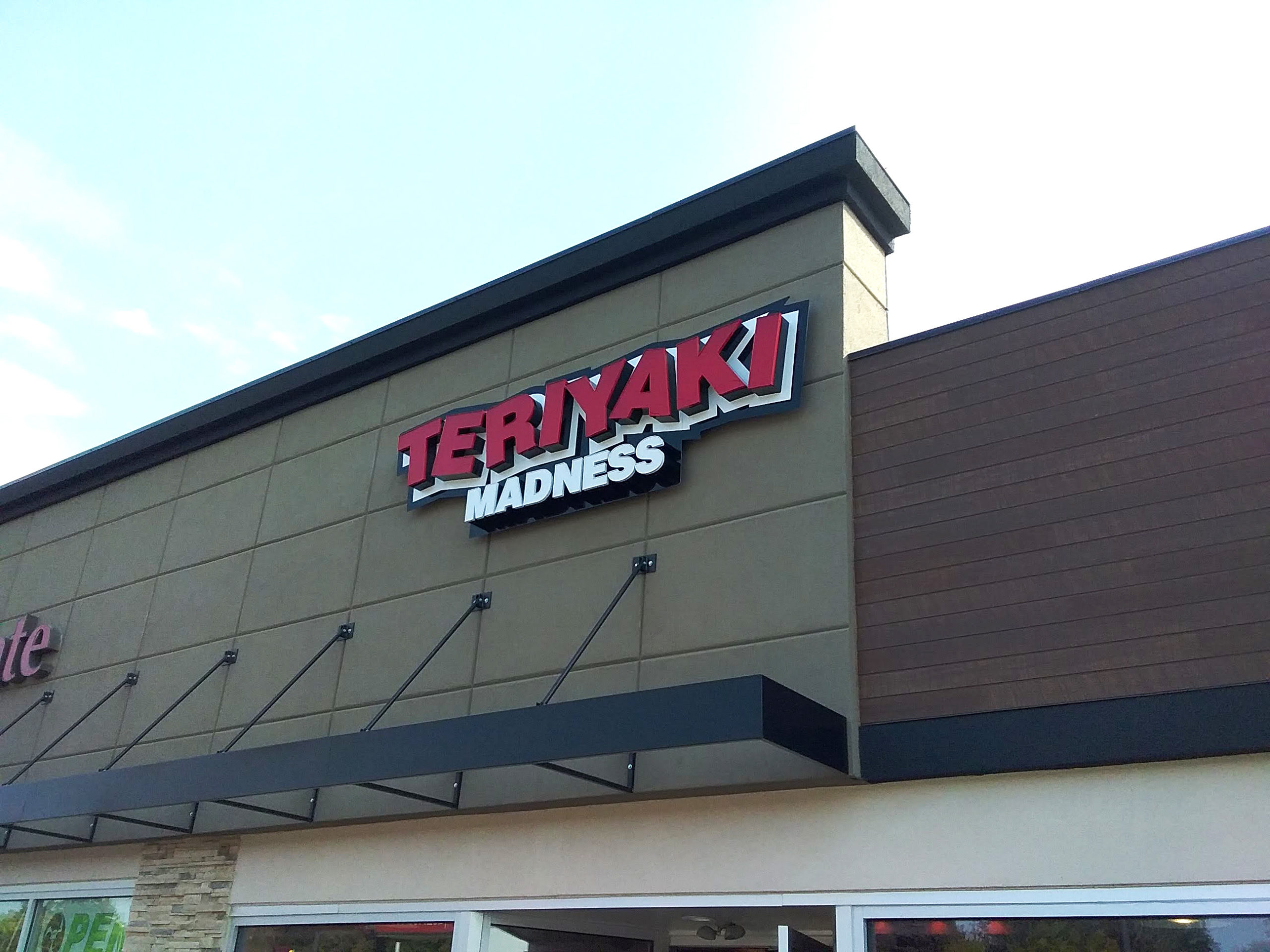 teriyaki madness business sign
