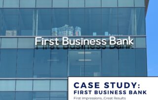 First Business Bank channel letter sign installation on a wall of windows.