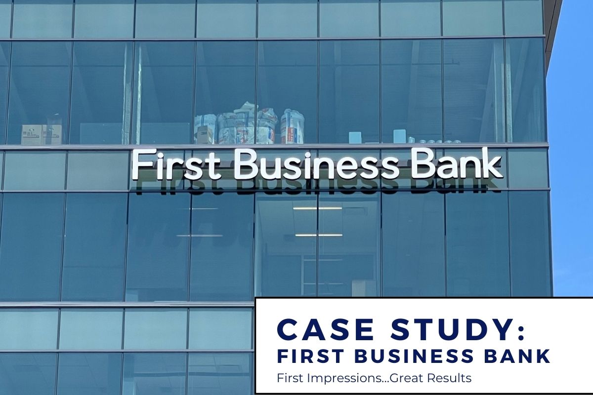 First Business Bank channel letter sign installation on a wall of windows.
