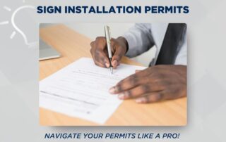 Learn more about sign installation permits from Innovative Signs. Image is of a man's hands signing paperwork.