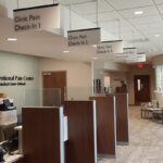 Interior healthcare facility signage in a waiting room.
