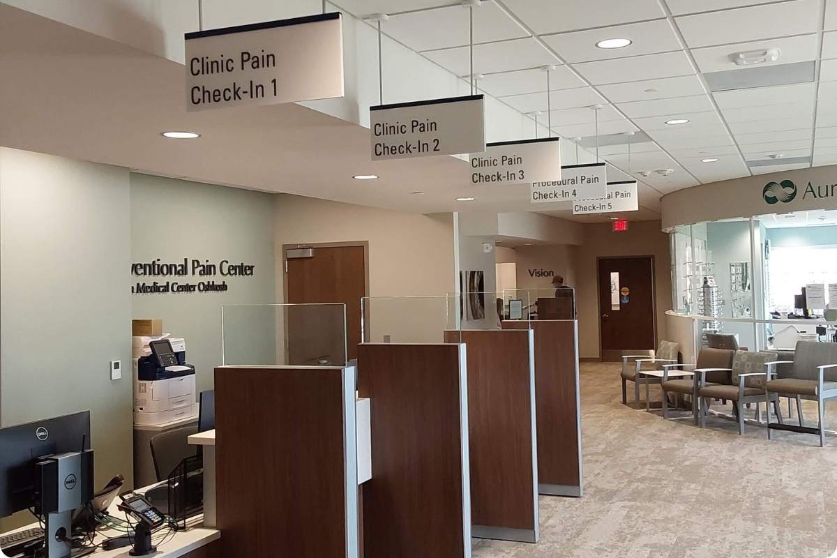 Interior healthcare facility signage in a waiting room.