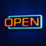 Classic orange neon "OPEN" sign.